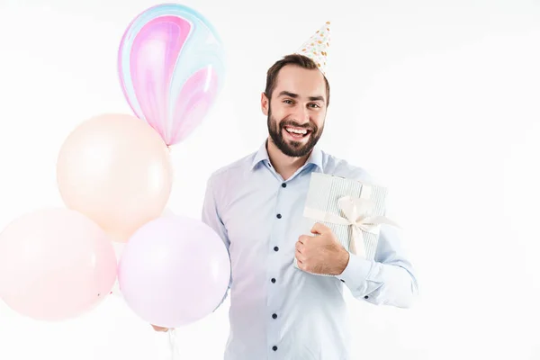 Imagen del hombre de la fiesta sonriendo mientras sostiene globos de aire y presen — Foto de Stock