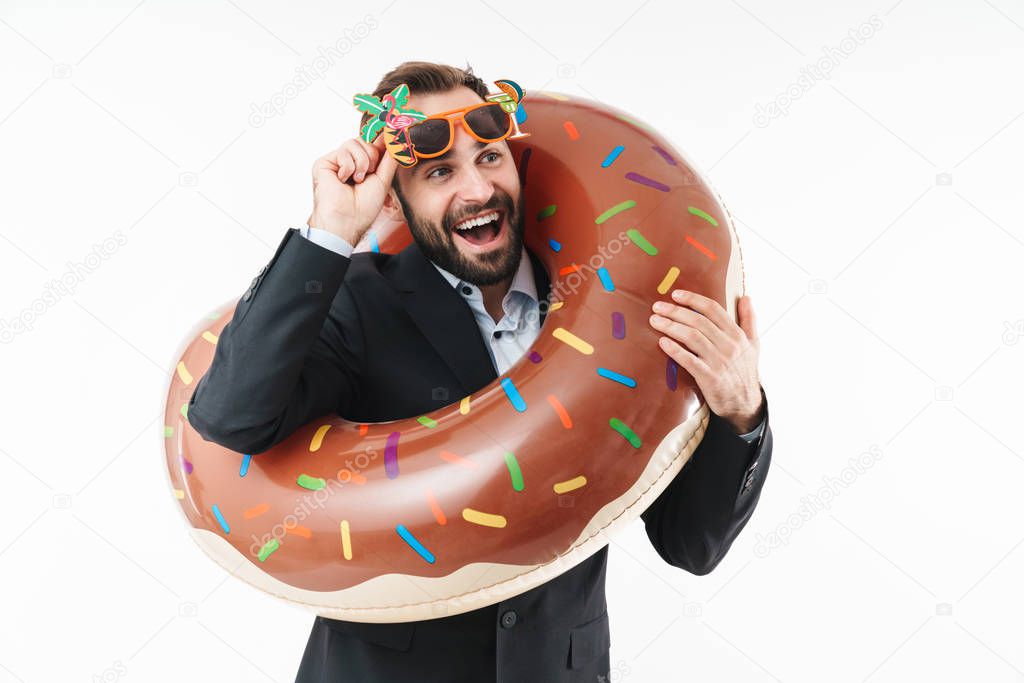Image of successful businessman smiling and standing in rubber s