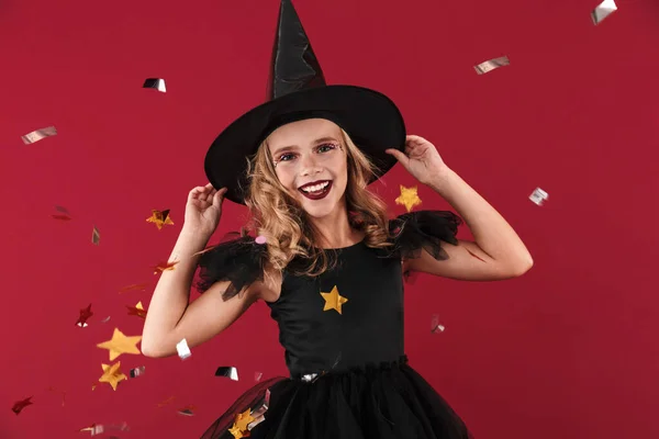 Happy little girl witch in carnival halloween costume — Stock Photo, Image