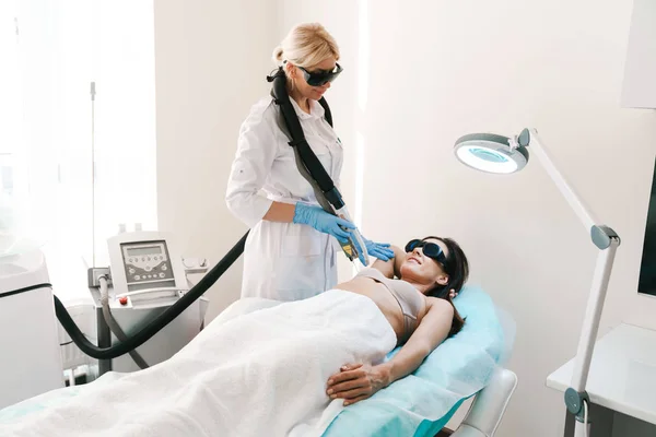 Photo of caucasian woman getting laser epilation procedure — 스톡 사진