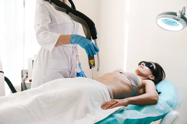 Photo of caucasian woman getting laser epilation procedure — 스톡 사진