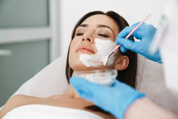 Photo of attractive caucasian woman getting cosmetic procedure — 스톡 사진
