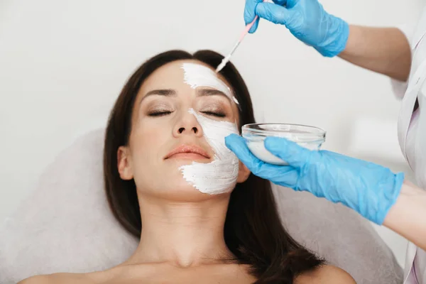 Photo of attractive caucasian woman getting cosmetic procedure — 스톡 사진