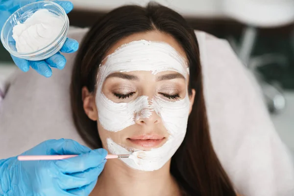 Photo of attractive adult woman getting cosmetic procedure — 스톡 사진