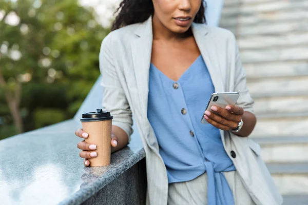 Attractive smiling african business woman walking outdoors — 스톡 사진