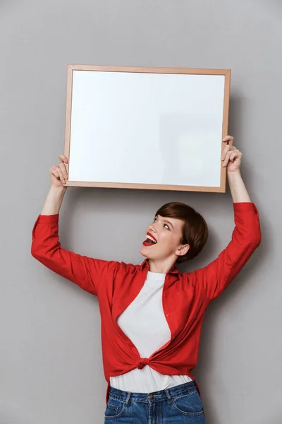 Image of attractive woman holding copyspace text board above her — Stock Photo, Image