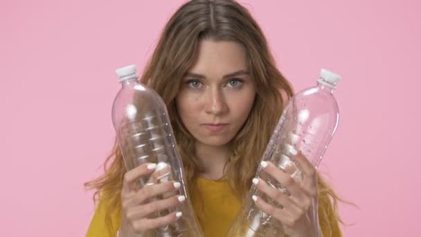 Angry Young Woman Holds Two Plastic Bottles Both Hands Compresses — Stock Video