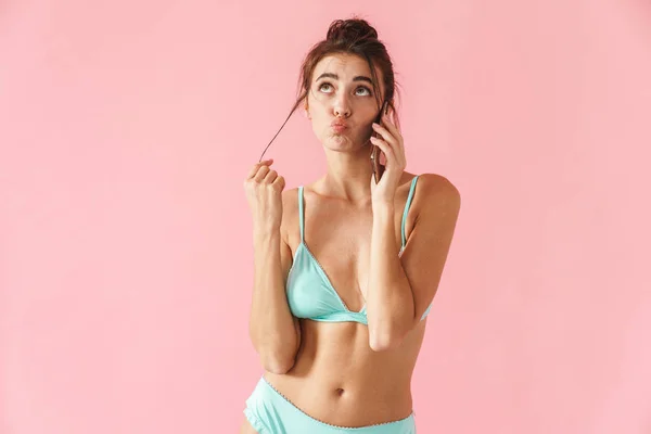 Beautiful young slim girl wearing bikini standing isolated — Stock Photo, Image