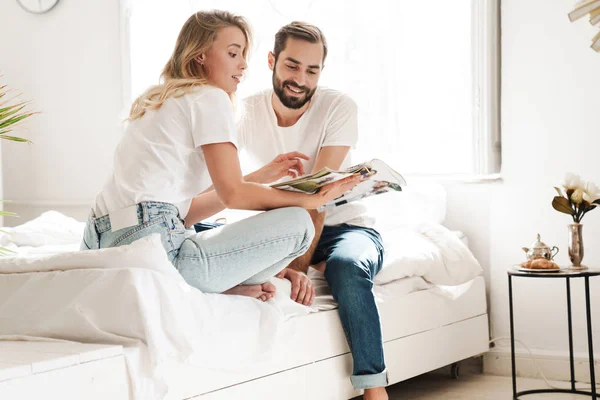 Happy young couple in love relaxing on a couch — 스톡 사진