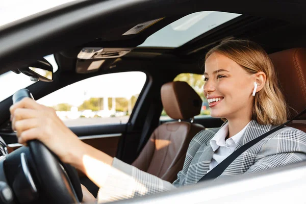 Image of young caucasian successful businesslike woman driving c — Stockfoto