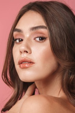 Portrait closeup of elegant young shirtless woman looking at cam