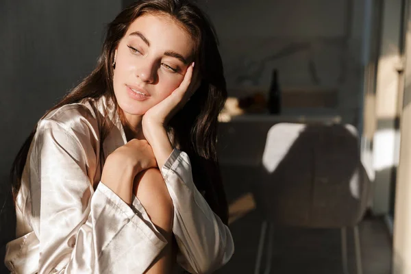 Pretty young woman indoors posing at home — Stock Photo, Image