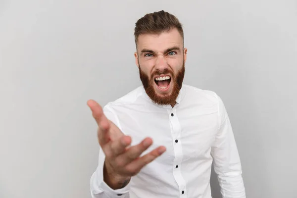 Image of bearded furious man looking and screaming at camera — 스톡 사진