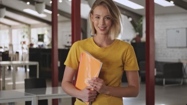 Smiling Beautiful Woman Holding Folders Files While Standing Conference Hall — Stockvideo