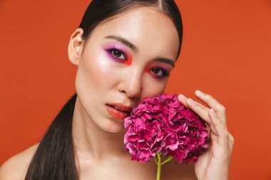 Beauty portrait of an attractive young topless asian woman
