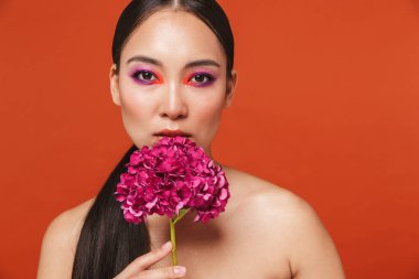 Beauty portrait of an attractive young topless asian woman