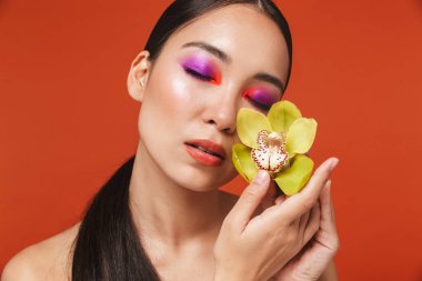 Beauty portrait of an attractive young topless asian woman