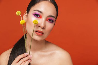 Beauty portrait of an attractive young topless asian woman