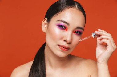 Beauty portrait of an attractive young topless asian woman