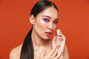 Beauty portrait of an attractive young topless asian woman