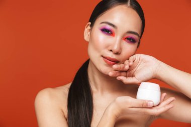 Beauty portrait of an attractive young topless asian woman