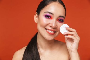 Beauty portrait of an attractive young topless asian woman