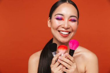 Beauty portrait of an attractive young topless asian woman