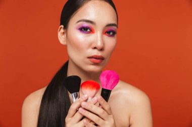Beauty portrait of an attractive young topless asian woman