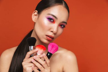 Beauty portrait of an attractive young topless asian woman