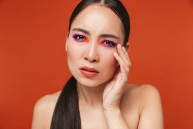 Beauty portrait of an attractive young topless asian woman