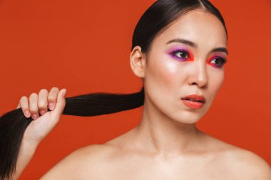 Beauty portrait of an attractive young topless asian woman