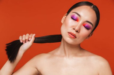 Beauty portrait of an attractive young topless asian woman