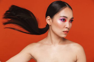 Beauty portrait of an attractive young topless asian woman