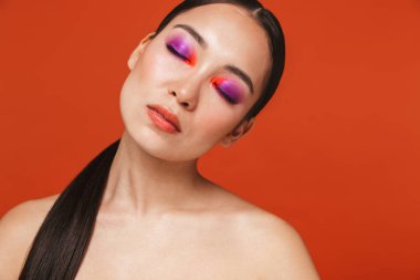Beauty portrait of an attractive young topless asian woman