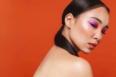 Beauty portrait of an attractive young topless asian woman