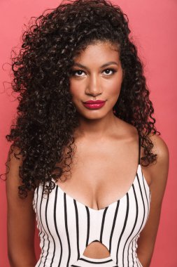 Image of pretty african american woman with curly hair looking a