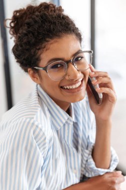 Close up of a smiling young african business woman
