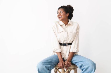 Beautiful cheerful young stylish african woman posing