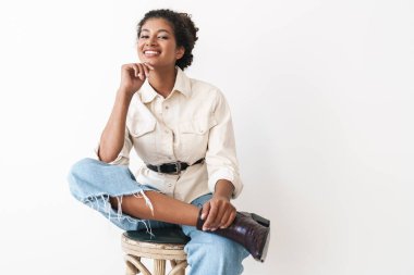 Beautiful cheerful young stylish african woman posing