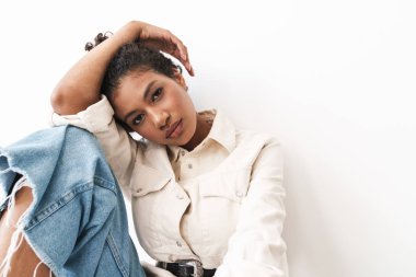 Beautiful cheerful young stylish african woman posing