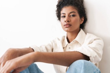 Beautiful cheerful young stylish african woman posing