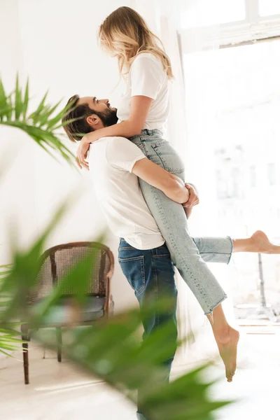 Loving couple indoors at home hugging. — Stok fotoğraf