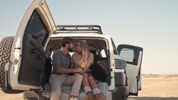 Young Attractive Couple Man Woman Smiling While Sitting Car Trunk — Stock Video