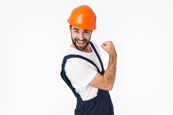 Foto Feliz Positivo Jovem Construtor Capacete Posando Isolado Sobre Fundo — Fotografia de Stock