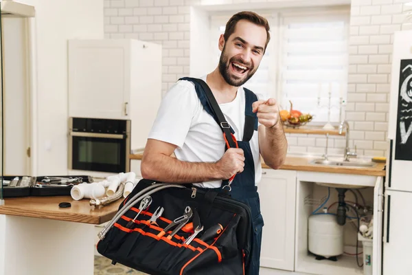 Imagen Del Joven Optimista Hombre Positivo Fontanero Trabajo Uniforme Interior —  Fotos de Stock