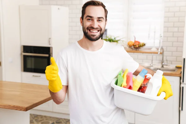 Image Young Cheerful Smiling Positive Man Househusband Indoors Showing Thumbs — Stock Photo, Image