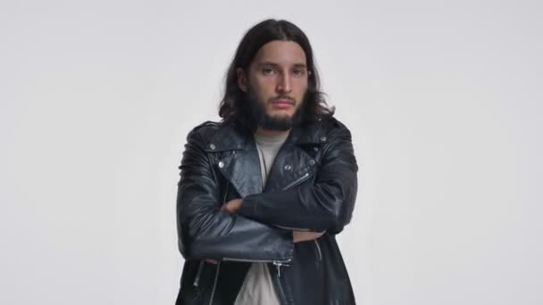 Displeased Young Man Long Hair Black Leather Jacket Standing Crossed — Stock Video