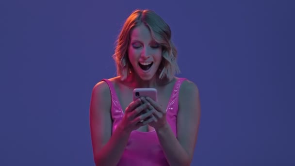 Happy Emotional Blonde Young Woman Doing Winner Gesture While Getting — Stock Video