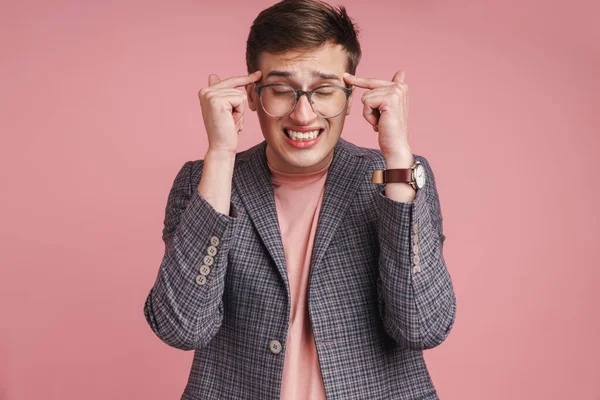 Photo Young Stressed Displeased Boy Headache Glasses Isolated Pink Wall — Stock Photo, Image