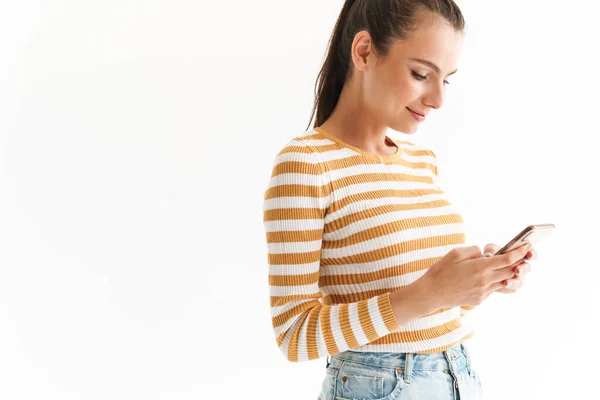 Smiling Young Girl Wearing Casual Clothing Using Mobile Phone While — Stock Photo, Image